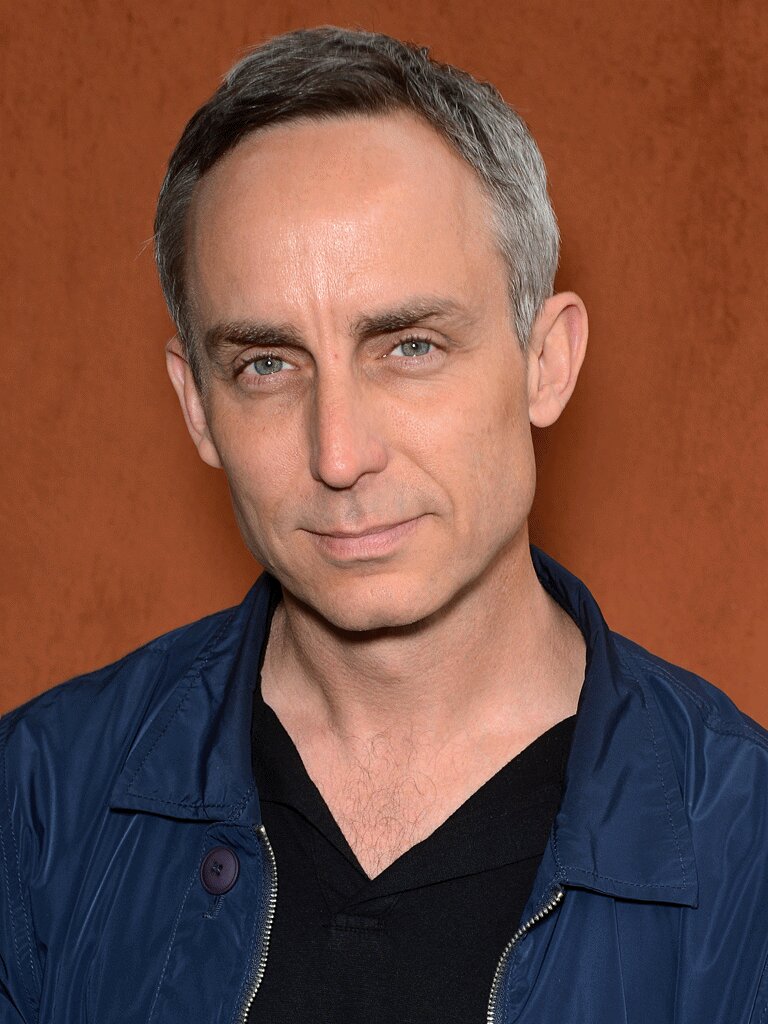 Wallace Langham — Dr. Damien Hodgman